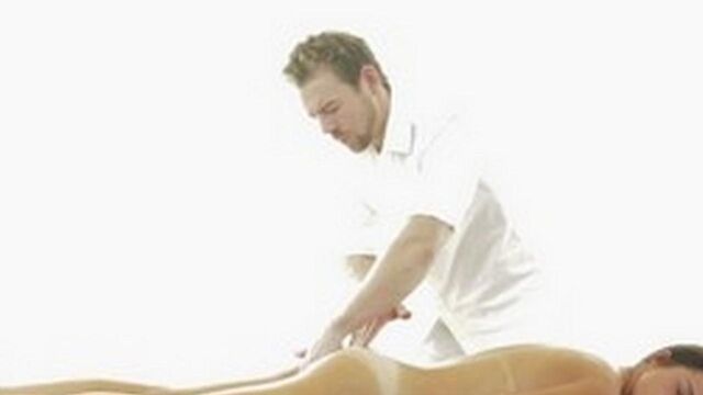 Caresses pussy with finger during erotic massage