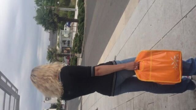 While she was waiting for the bus, he just shuddered and came on her clothes