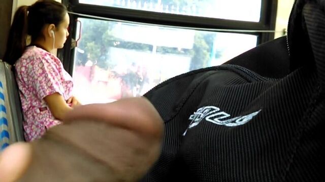 A sick pervert jerks off right on the bus, looking at a sexy girl