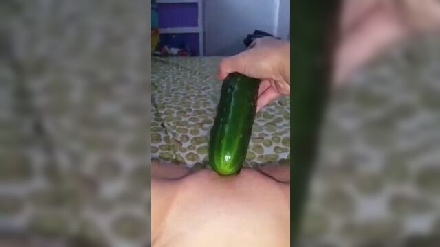 masturbates with cucumber