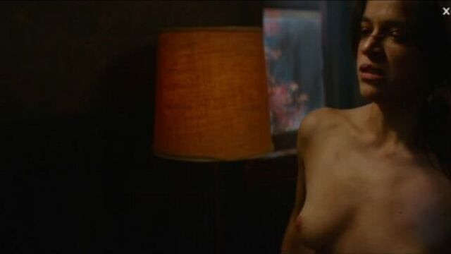 Michelle Rodriguez looks at herself naked in the mirror