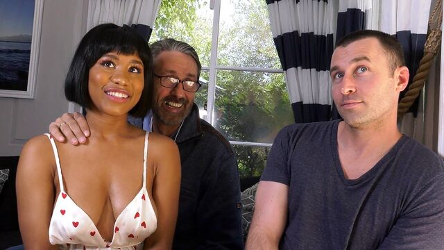 Short-haired black woman with big natural tits serves two cocks at the same time