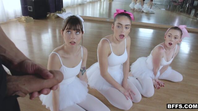 Three pretty ballerinas in pantyhose please an excited male on the floor