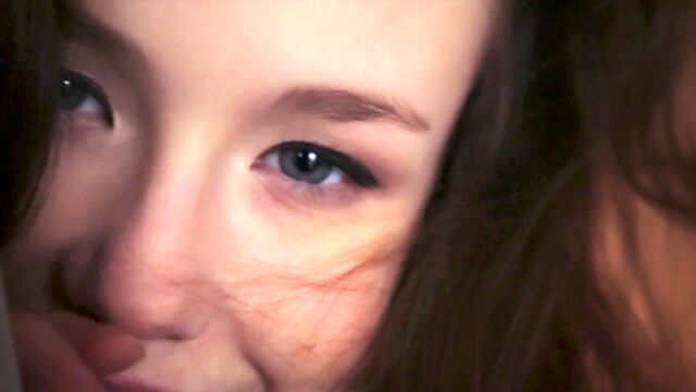 Emily Bloom slowly undresses in front of the camera, revealing her charms