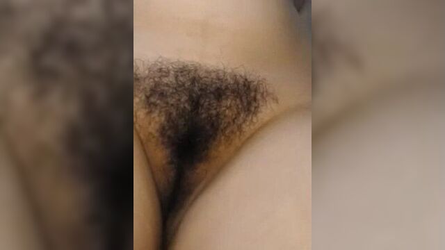 Pussy of a girl with diamond-shaped pubic hair