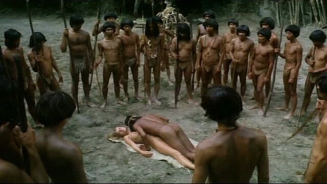 A tribe of savages take turns raping a white girl (they let them go in a circle, they rape in turn, they end up in a crowd, sex of savages)