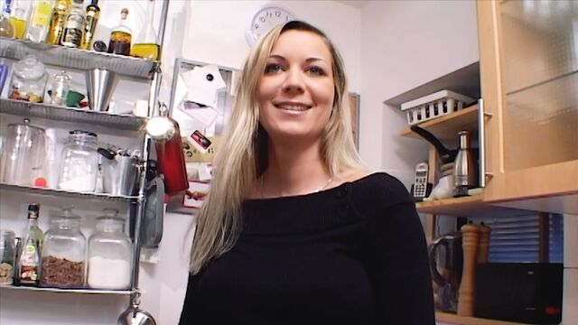 Outstanding German MILF with huge tits dildo fucks her shaved pussy in the kitchen
