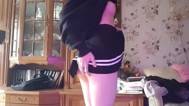 in a miniskirt shows her body