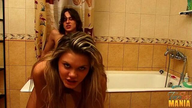 Morning sex of a young couple in the bathroom