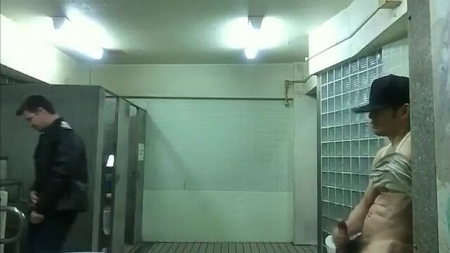 Jerking off in the open in the toilet in front of a guy