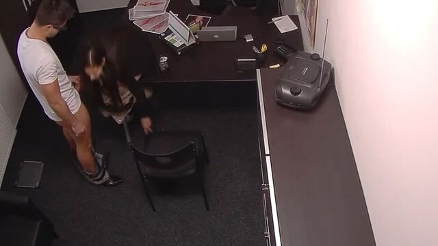 The manager fucks a beautiful guest on the table in the office under a hidden camera