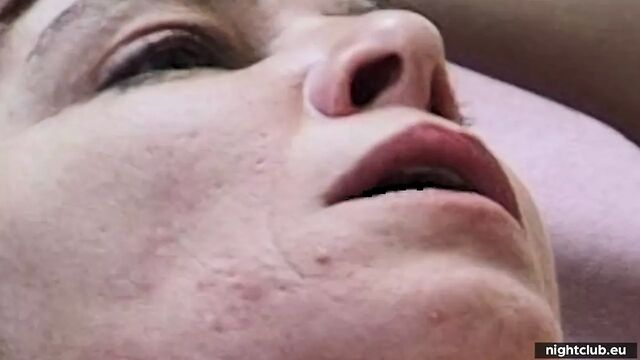 Expressions on the face of a woman being fucked and given a blowjob
