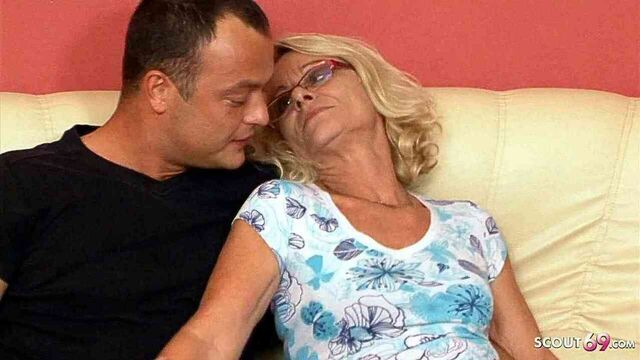 A slender mature granny was seduced to have sex with a young guy next door