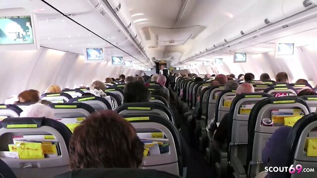 German MILF flashes huge tits on plane and rides on vacation