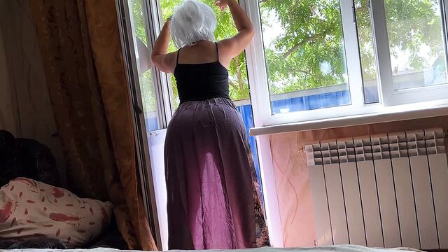 Through the milf's see-through dress you can see her ass for anal sex