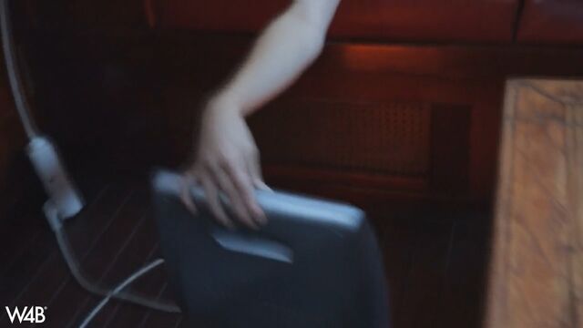 Close-up nude photo shoot on a red leather sofa