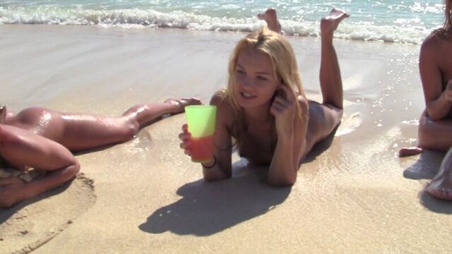 Naked girls on the beach are rocking.