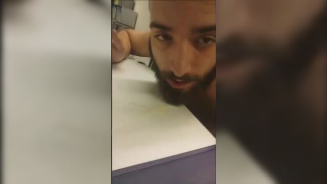 Bearded man jerks off and eats his cum