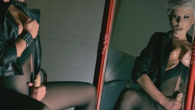 Admiring himself in the mirror