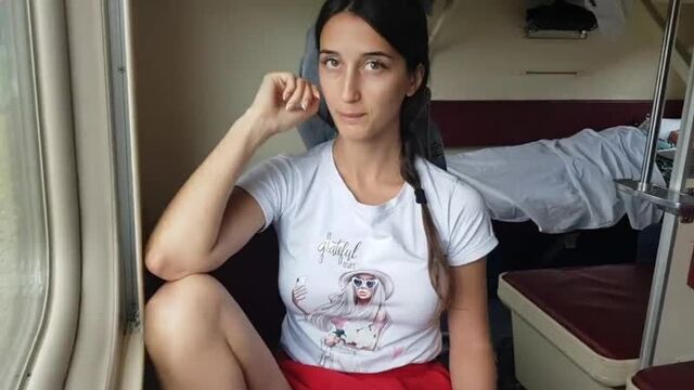 A girl rides on a train without panties and shows her pussy.