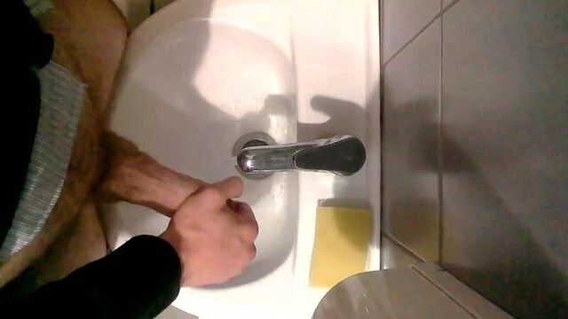 Caucasian man jerks off and cums at work